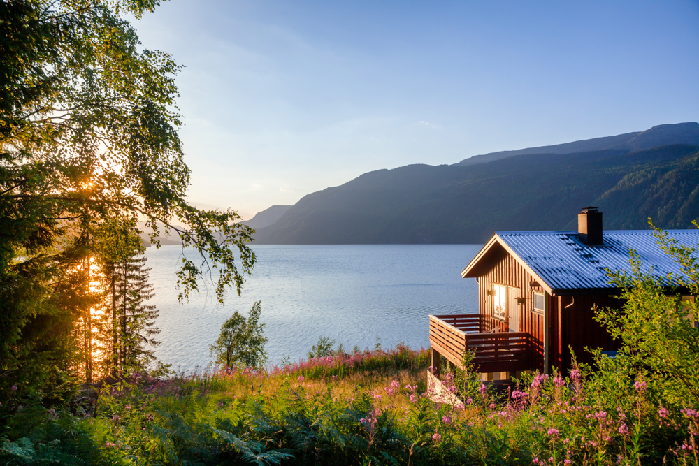 Norwegian,Wooden,Summer,House,(hytte),With,Terrace,Overlooking,Scenic,Lake